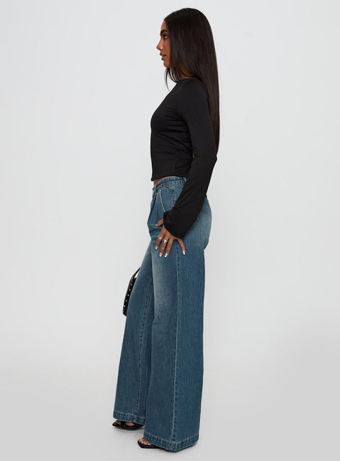 side view of model wearing Princess Polly Laguardia Mid Rise Wide Leg Jeans Dark Blue Wash Mid Rise Jeans Jeans 