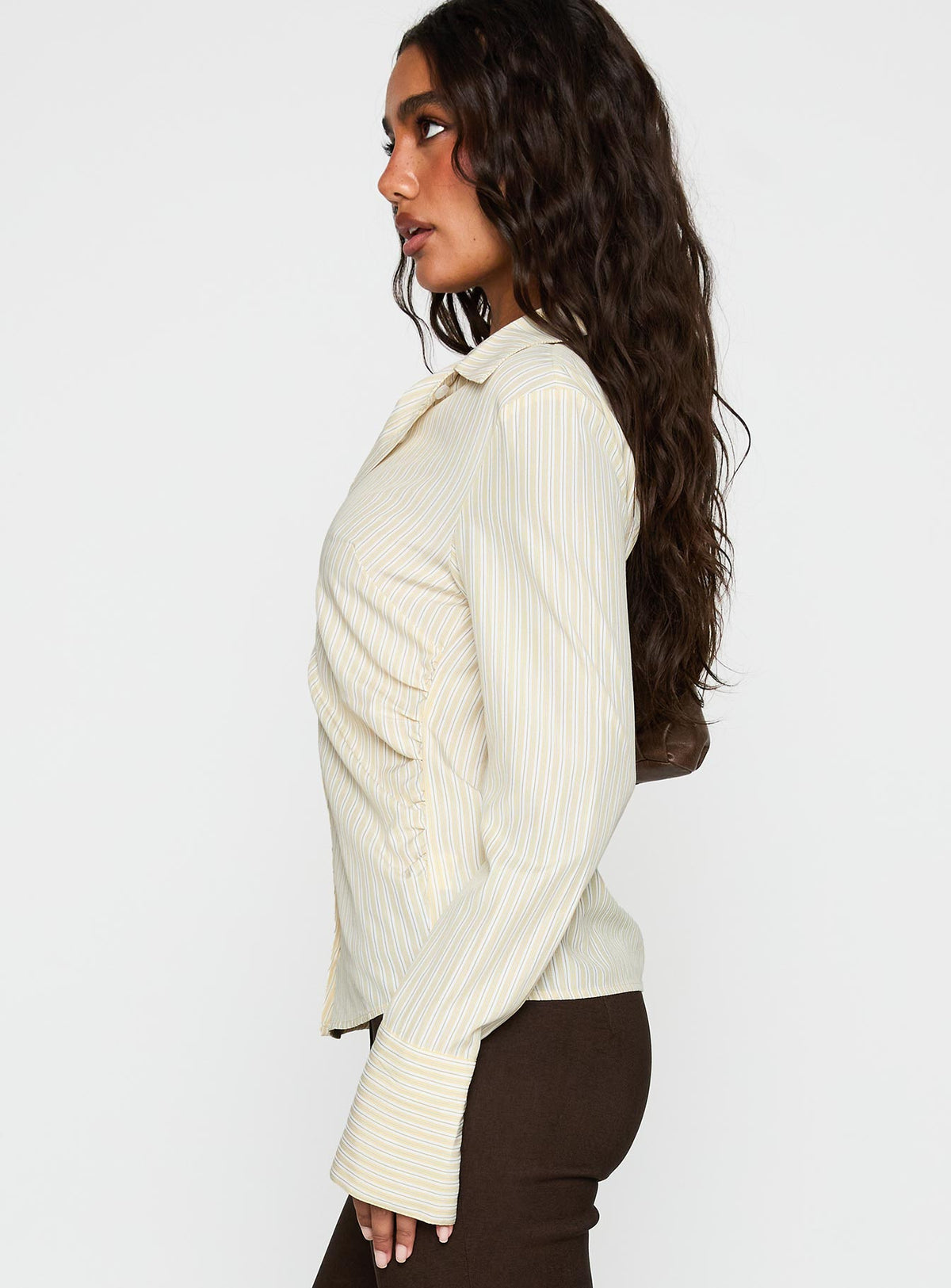 side view of model wearing Princess Polly Rush Hour Long Sleeve Top Yellow Stripe Full Sleeves V-Neck 