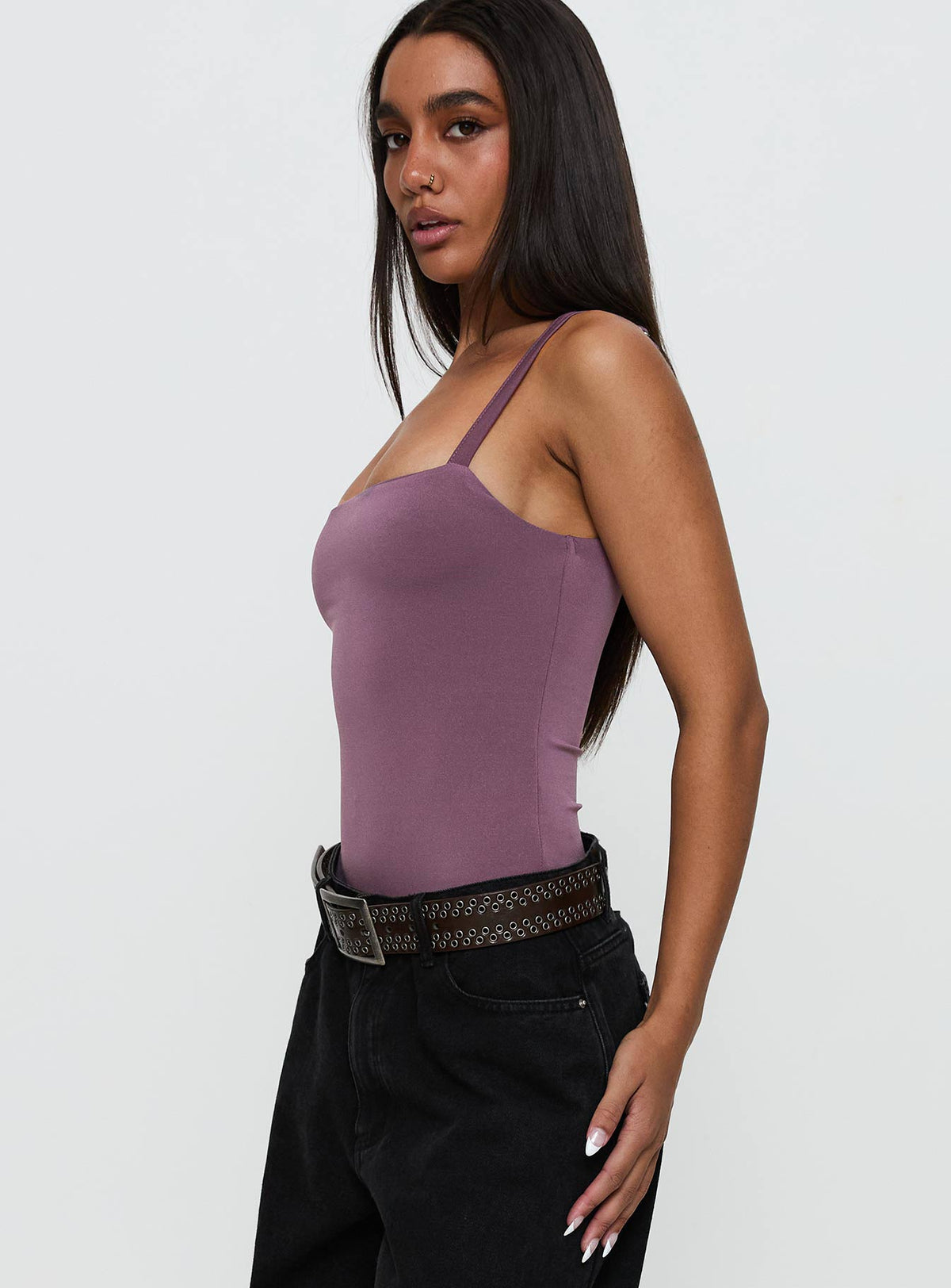 side view of model wearing Princess Polly Off Stage Bodysuit Purple Sleeveless Bodysuit 