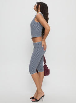 side view of model wearing Princess Polly Tuka Capri Navy Gingham Mid Rise Pants Pants 