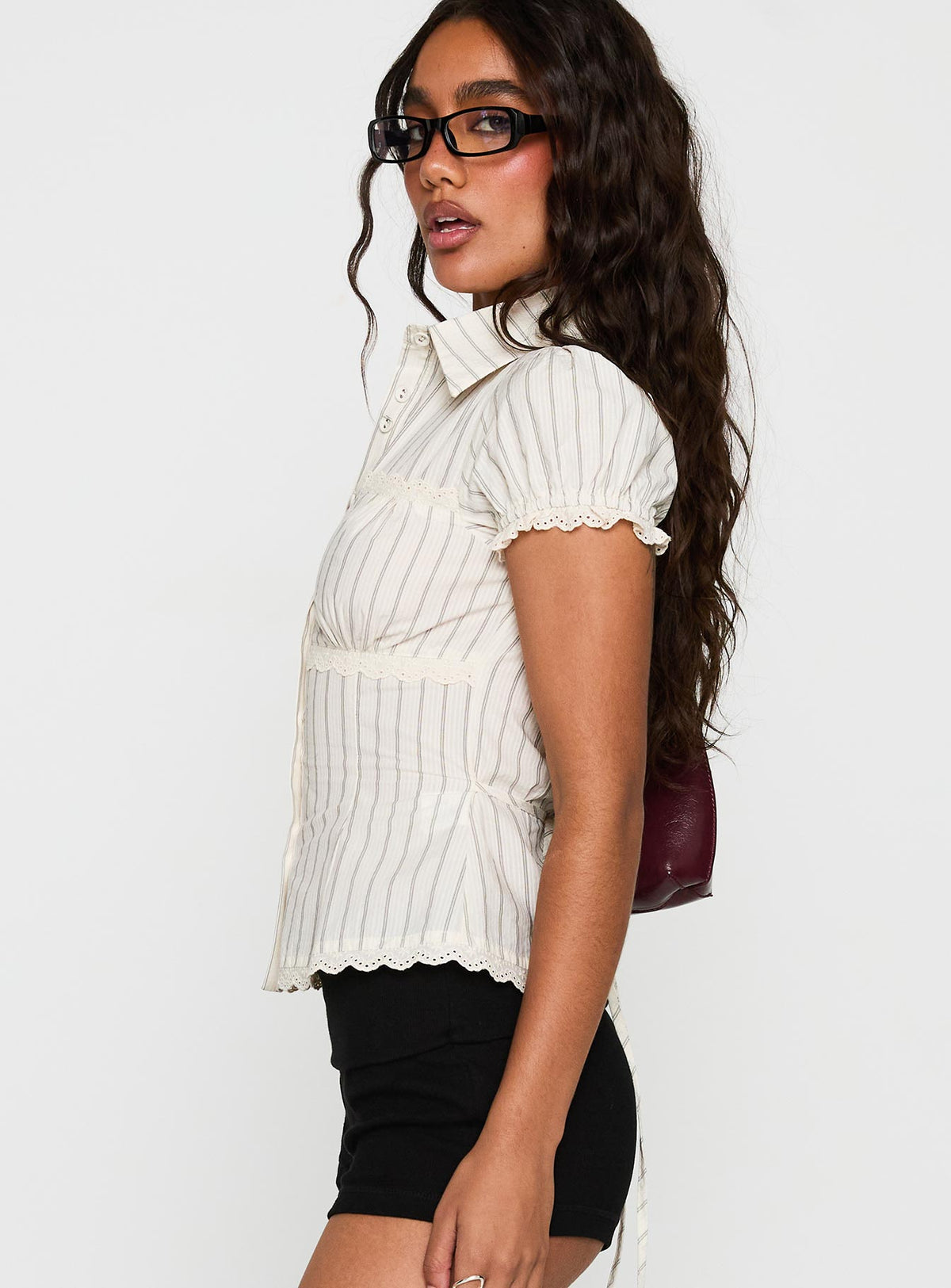 side view of model wearing Princess Polly Deserve You Puff Sleeve Button Front Top Cream Stripe Short Sleeves V-Neck 