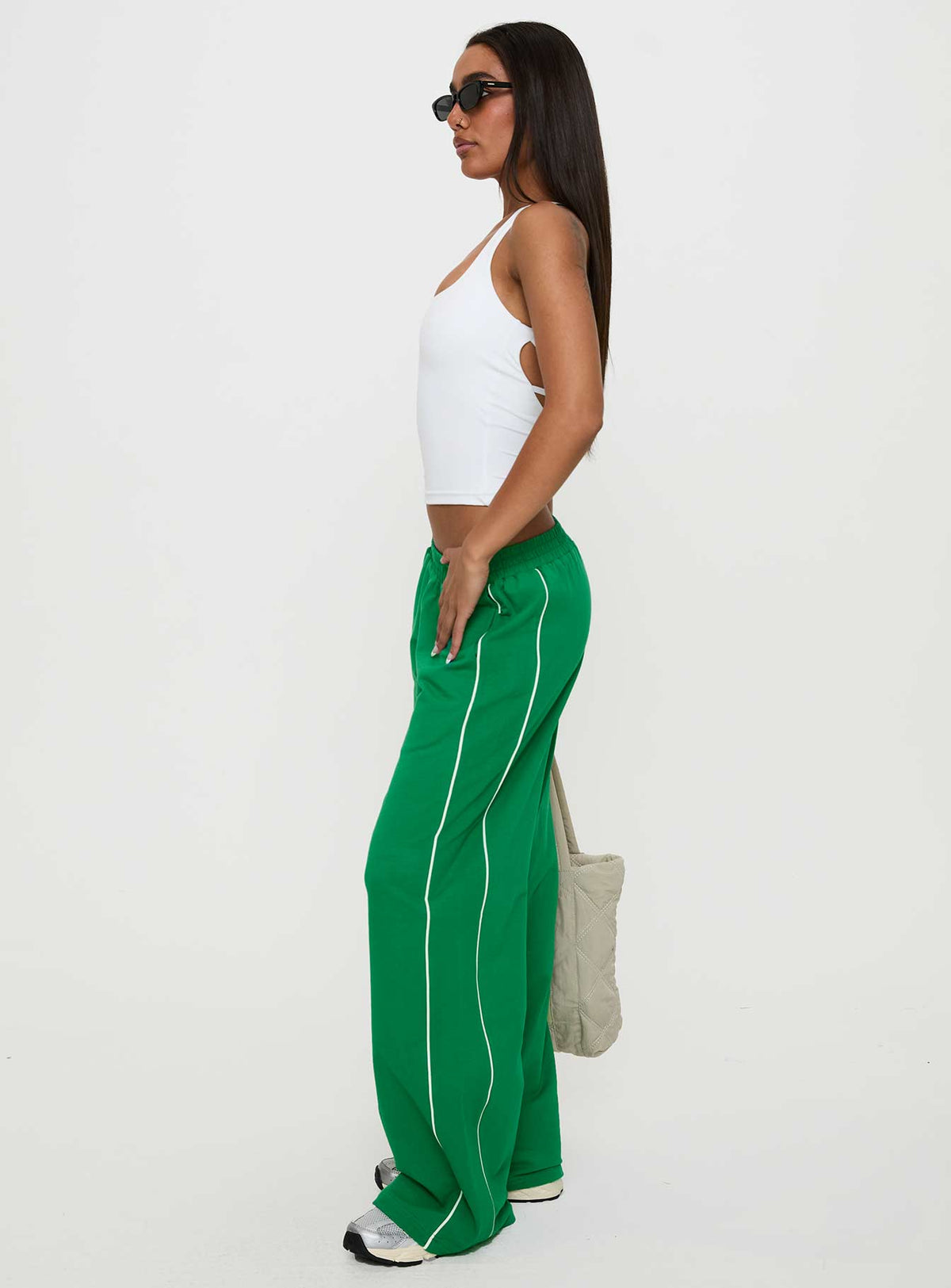 side view of model wearing Princess Polly Field Day Track Pants Green High Rise Pants Pants 