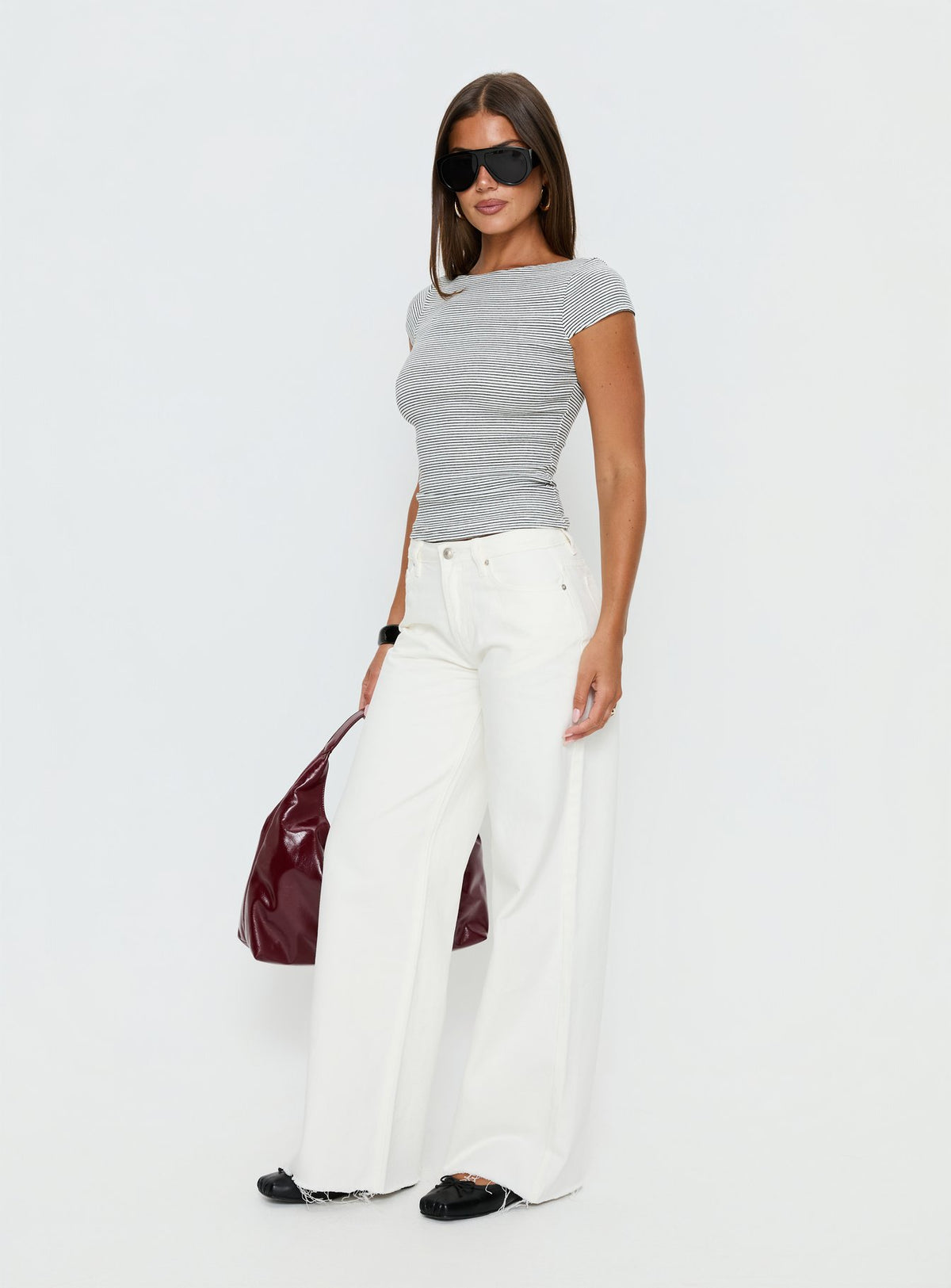 Showcasing the Darla Low Rise Straight Leg Jean White in womens-jeans front view of model wearing Princess Polly