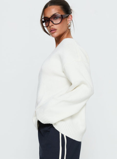 side view of model wearing Princess Polly Kaileigh V Neck Knit Sweater Cream Longline Jumpers Jumpers 