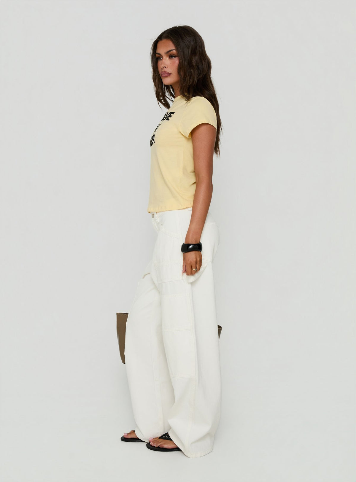 Discover Mistree Mid Rise Baggy Cargo Jeans White in womens-jeans with mid-rise side view of model wearing Princess Polly