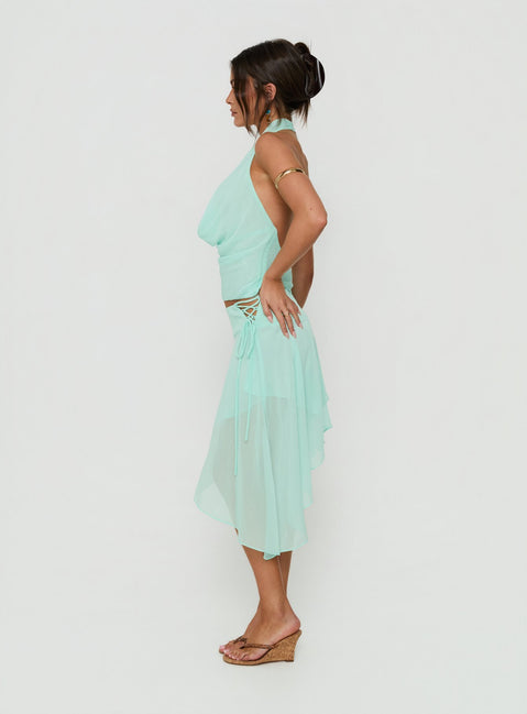 Featuring the Evaleine Asymmetrical Chiffon Midi Skirt Blue womens-skirts with asymmetry shape side view of model wearing Princess Polly