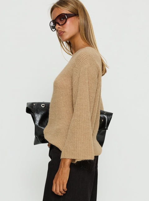 Designed with an oversized fit, the Delyn Off Shoulder Slouchy Knit Sweater Camel womens jumper in short length side view of model wearing Princess Polly