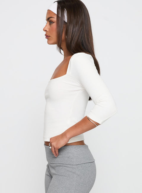 side view of model wearing Princess Polly So American Rib 3/4 Sleeve Top White Three Fourth Sleeves Square Neck 