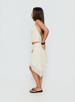 Designed with the Gemmina Asymmetrical Chiffon Mini Skirt Cream womens-skirts in relaxed fit featuring mini length side view of model wearing Princess Polly