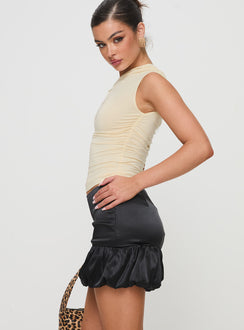   side view of model wearing Princess Polly Ravioli Bubble Hem Mini Skirt Black Mini Skirts Skirts 