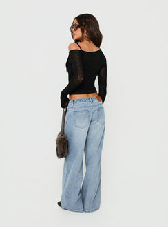 Crafted with Picco Ultra Low Rise Wide Leg Jeans Light Blue Wash Petite in womens-jeans featuring a low-rise waistband back view of model wearing Princess Polly