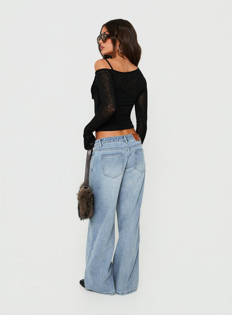 Crafted with Picco Ultra Low Rise Wide Leg Jeans Light Blue Wash Petite in womens-jeans featuring a low-rise waistband back view of model wearing Princess Polly