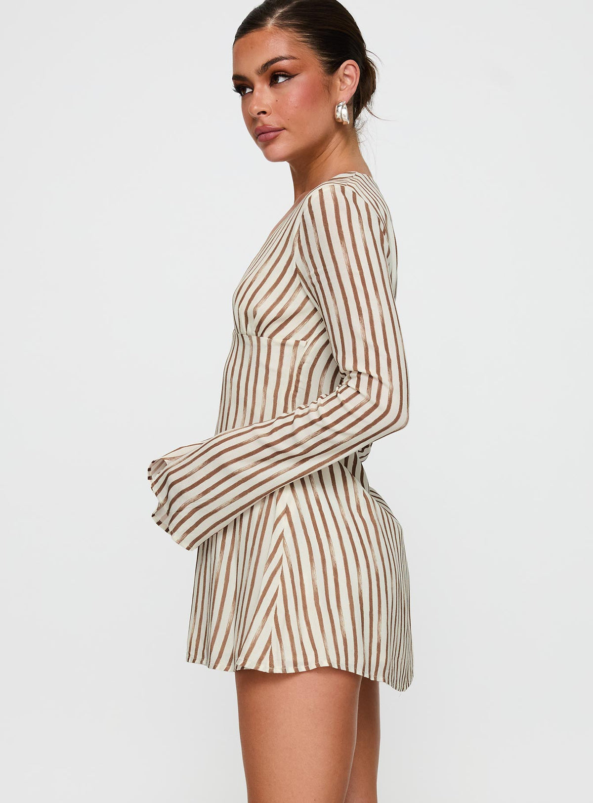 side view of model wearing Princess Polly The Good Life Mini Dress Brown / White Stripe Plunger 
