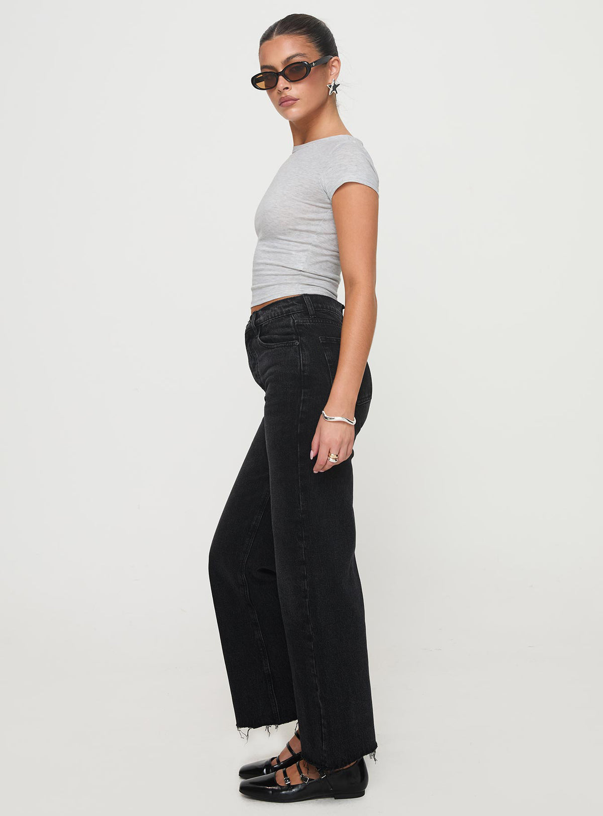 side view of model wearing Princess Polly Fawcett High Rise Straight Leg Jeans Washed Black High Rise Jeans Jeans 