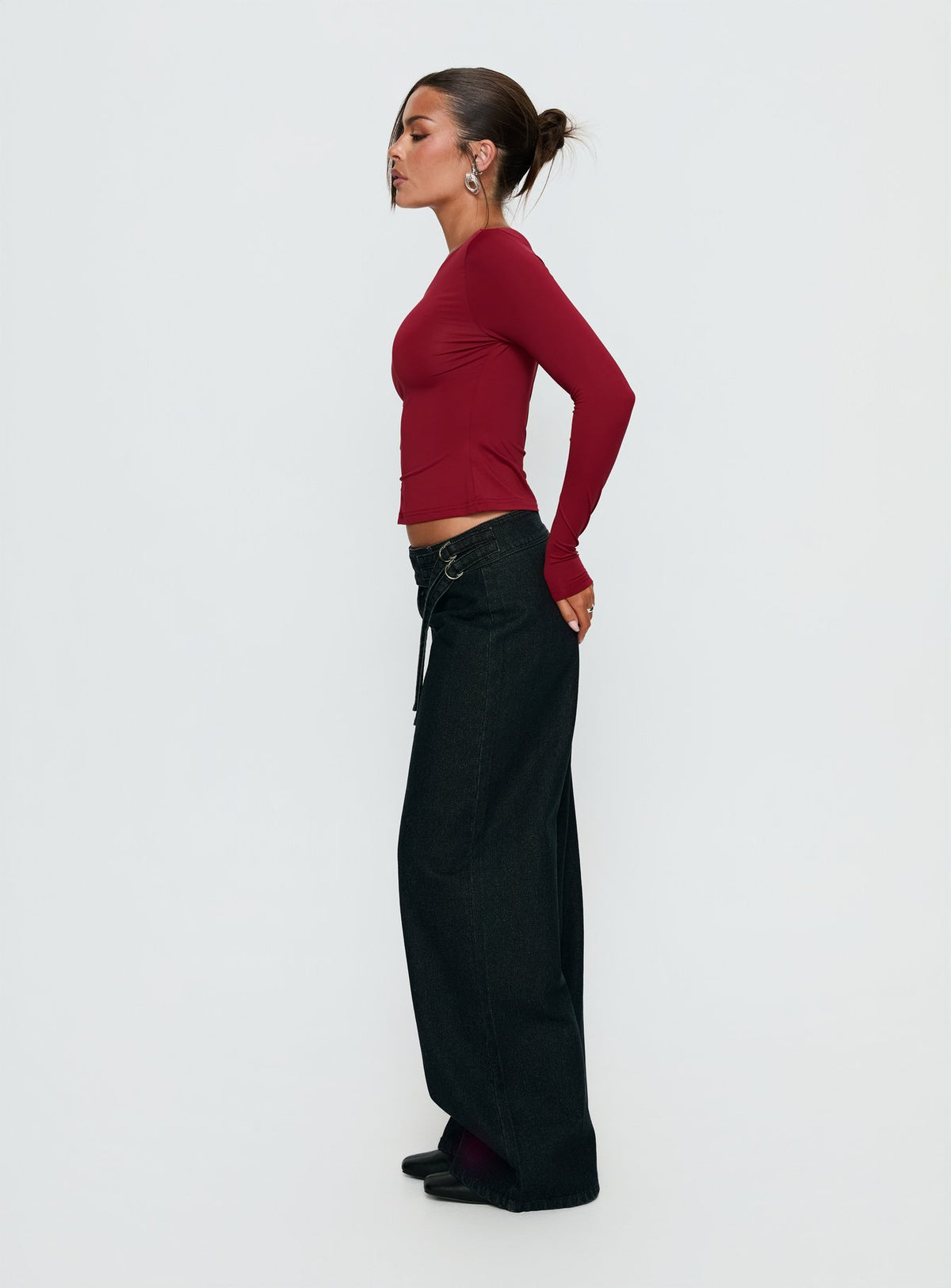 side view of model wearing Princess Polly Boxie Mid Rise Wide Leg Jeans Washed Black Mid Rise Jeans Jeans 