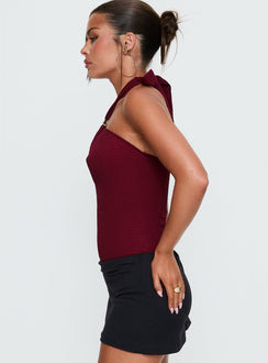 side view of model wearing Princess Polly Bridey Cut Out Bodysuit Red Sleeveless Bodysuit 