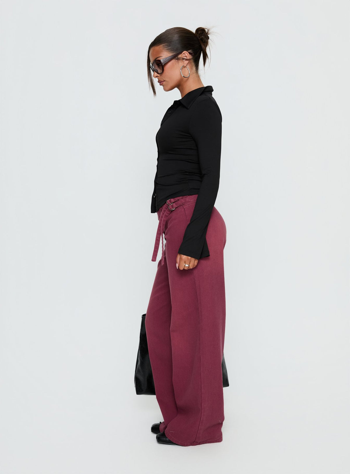 side view of model wearing Princess Polly Boxie Mid Rise Wide Leg Jeans Washed Burgundy Mid Rise Jeans Jeans 