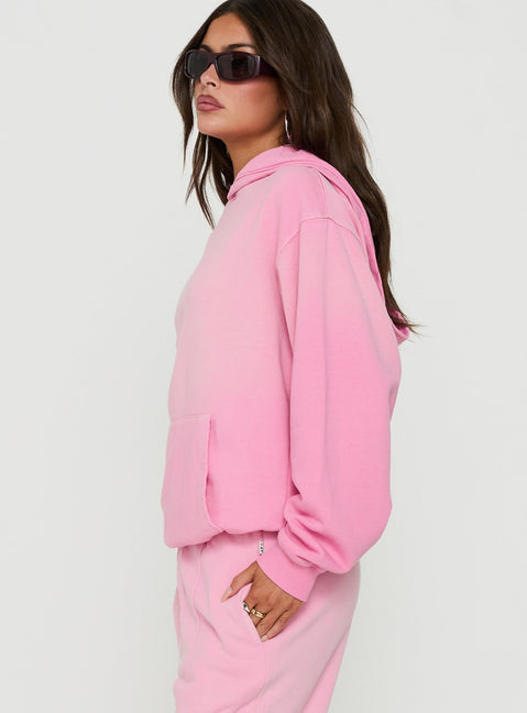 Highlighting the AT Pullover Oversized Hoodie in Washed Pink womens-jumpers with long length and hooded neckline on model angled to showcase silhouette view of model wearing Princess Polly