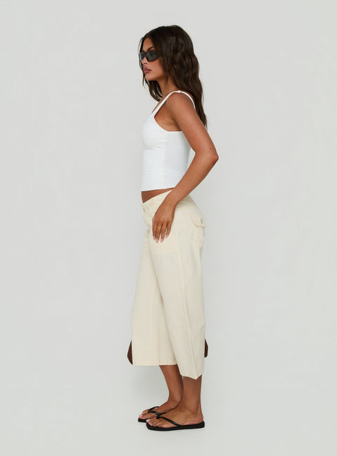 Designed with versatility, the Miska Wide Leg Capri Pants Off White womens-regular-pants featuring mid-rise waist side view of model wearing Princess Polly