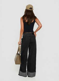 Featuring the Nikoletta Foldover Jeans Washed Black in high-rise wide-leg silhouette back view of model wearing Princess Polly