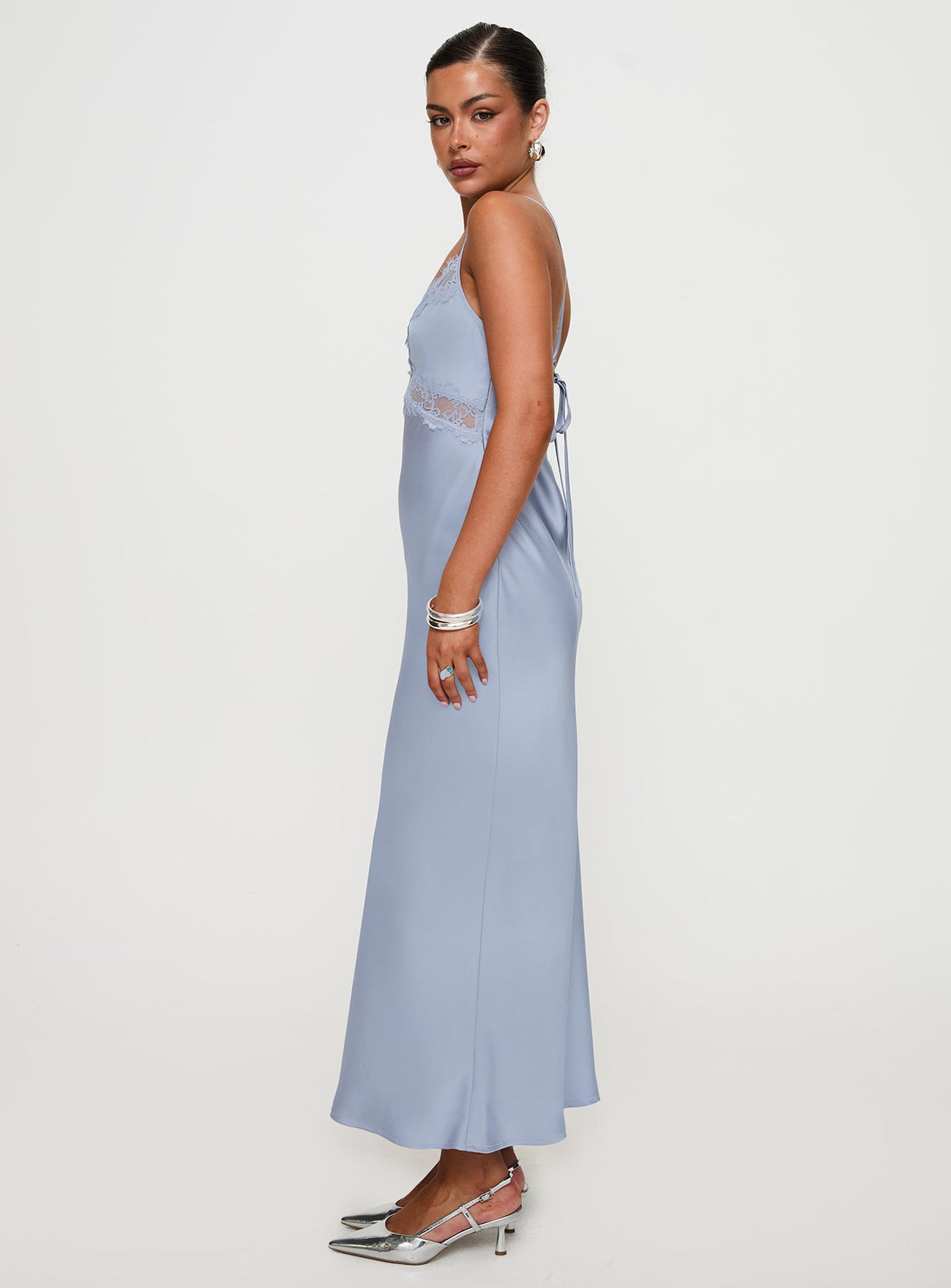 side view of model wearing Princess Polly Treasure Bias Cut Maxi Dress Blue V-Neck 