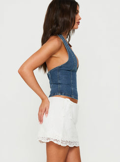 Explore the Always Dancing Embroidered Mini Skirt White womens-skirts in mini length side view of model wearing