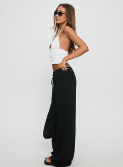 side view of model wearing Princess Polly Raymonde Pants Black High Rise Pants Pants 