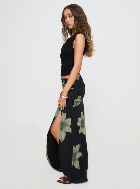   side view of model wearing Princess Polly Cooperi Maxi Skirt Black Floral Maxi Skirts Skirts 