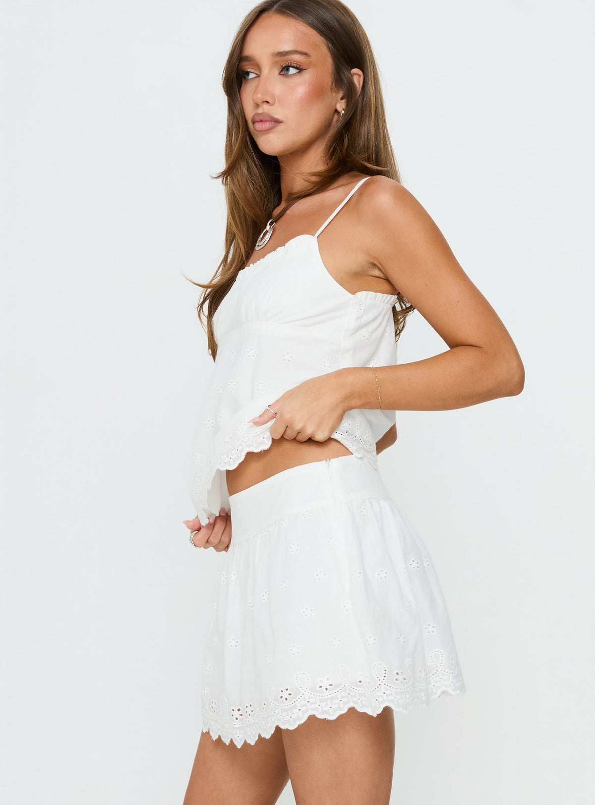   side view of model wearing Princess Polly Tiriah Embroidered Mini Skirt White Mini Skirts Skirts 