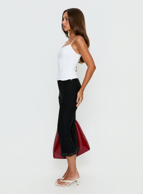 side view of model wearing Princess Polly Darsie Frill Capri Black Polka Dot High Rise Pants Pants 
