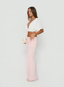 Showcasing the Isador Ruched Maxi Skirt Pink in womens-skirts with fitted a-line silhouette and solid light pink hue side view of model wearing Princess Polly