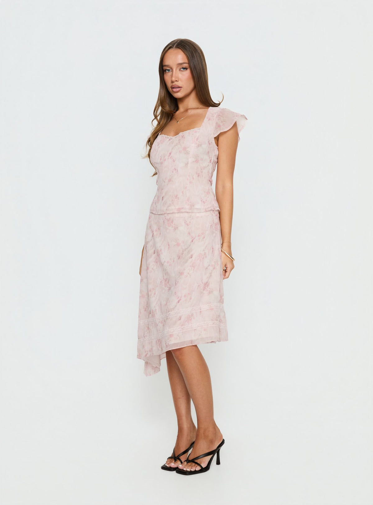   side view of model wearing Princess Polly Avaline Asymmetrical Midi Skirt Pink Skirts 