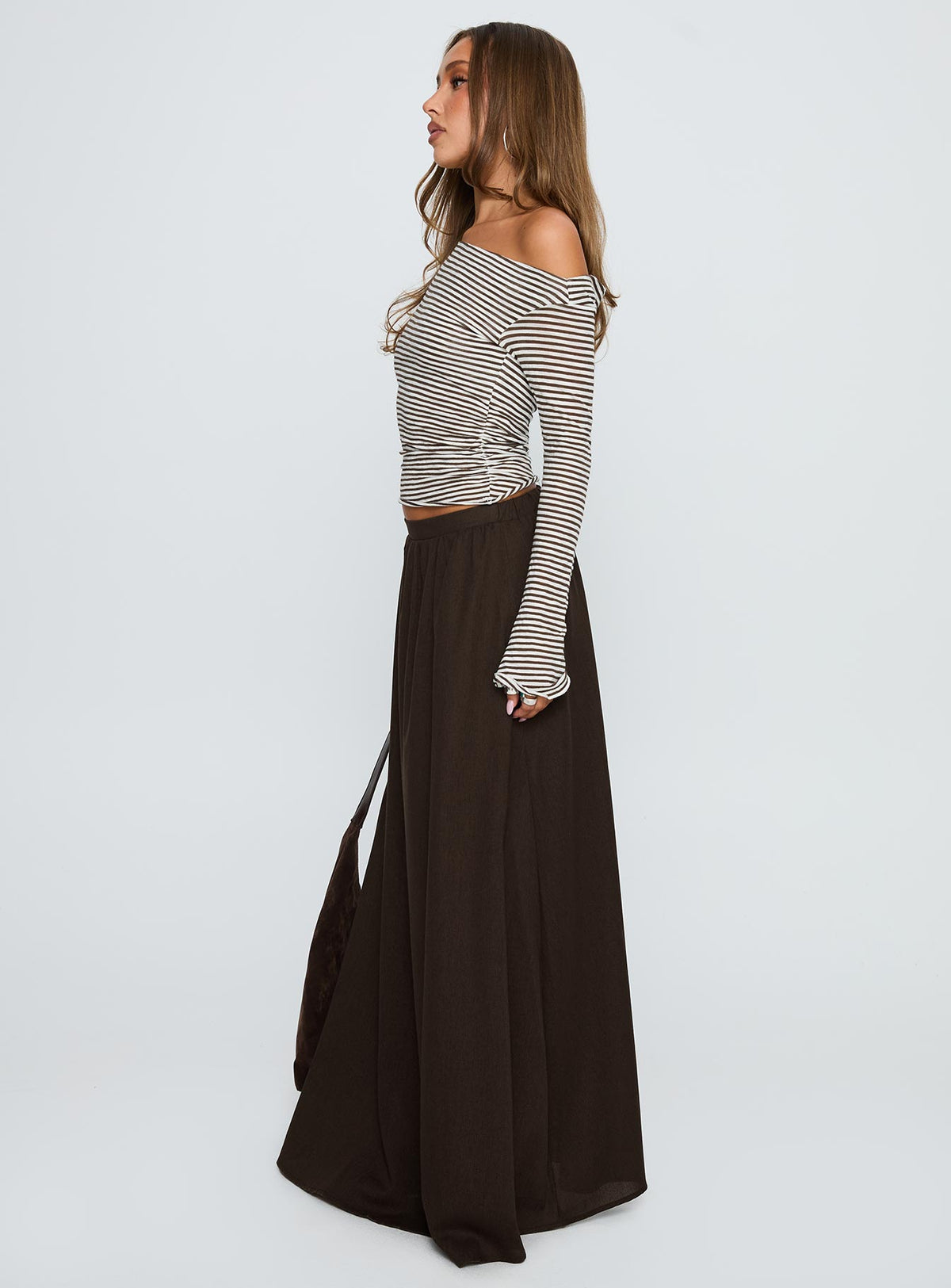   side view of model wearing Princess Polly Hallee Maxi Skirt Brown Maxi Skirts Skirts 
