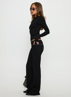 side view of model wearing Princess Polly Kobee Jersey Flare Pants Black / Grey Mid Rise Pants 
