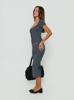 Presenting the Mayvie Capri Pants Navy Check in womens regular pants with high-rise waist side view of model wearing