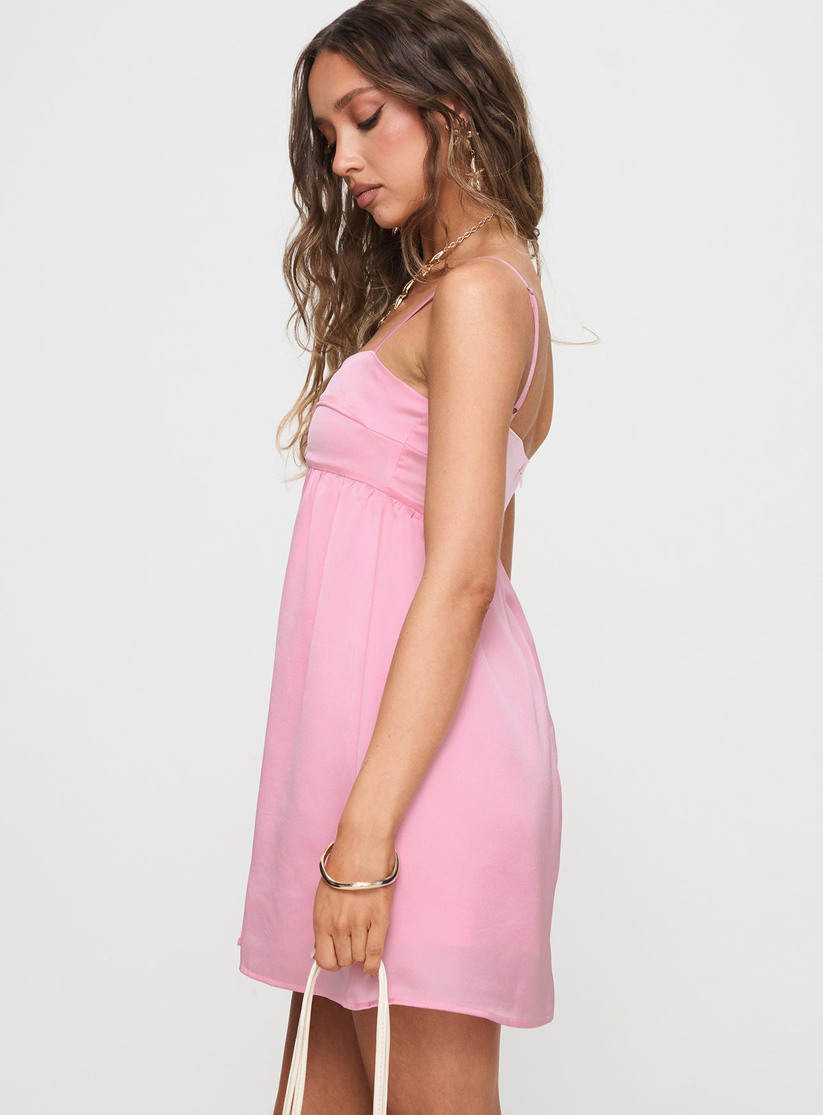side view of model wearing Princess Polly Ortega Mini Dress Pink Square Neck 
