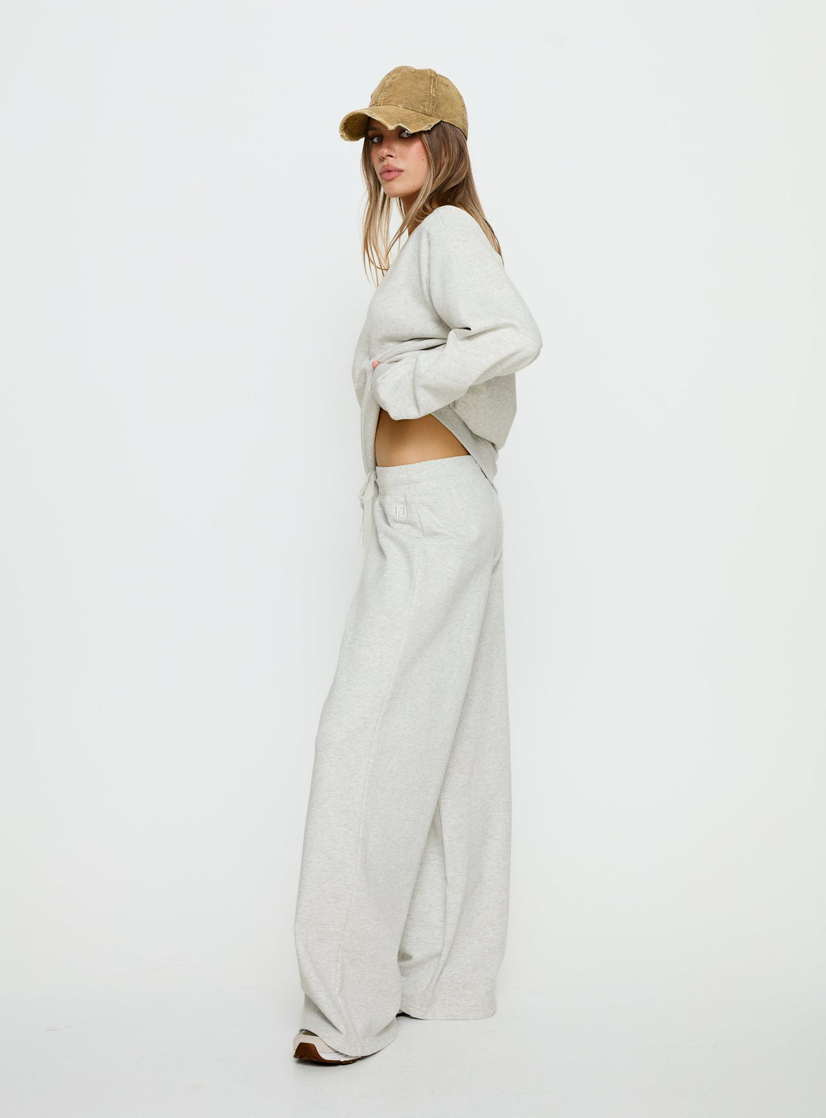 side view of model wearing Princess Polly Dodie Wide Leg Pants Grey Marle Mid Rise Pants Pants 