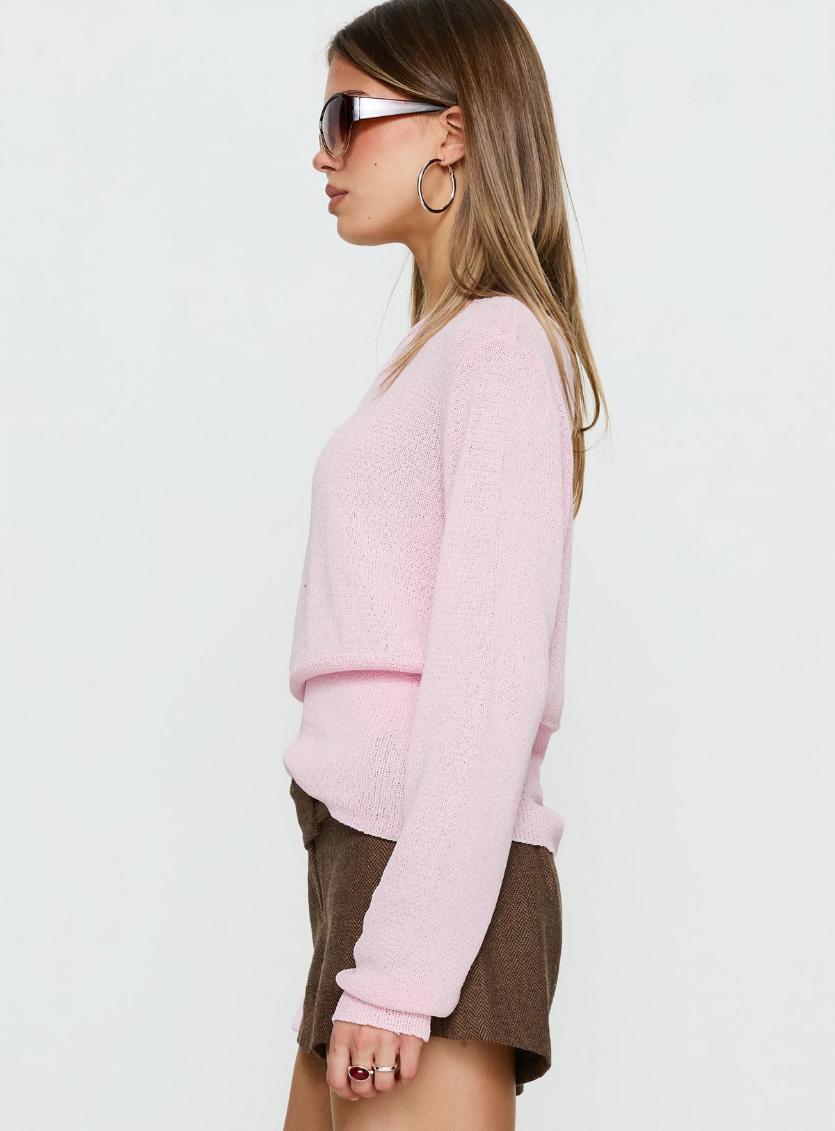 side view of model wearing Princess Polly Xaria Off Shoulder Knit Sweater Pink regular Jumpers 