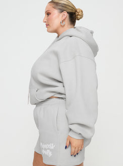 side view of model wearing Princess Polly Princess Polly Hooded Sweatshirt Puff Text Grey Curve Jumpers 