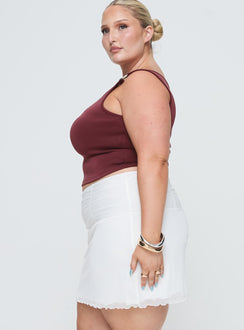   side view of model wearing Princess Polly Meredith Ruched Mini Skirt White Curve Mini Skirts Skirts 