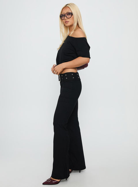 side view of model wearing Princess Polly Kortnee Eyelet Detail Flare Leg Pants Black Low Rise Pants Pants 