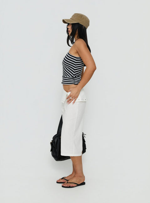 Featuring the Oren Capri Trouser Ivory womens-regular-pants with mid-rise and belt side view of model wearing Princess Polly