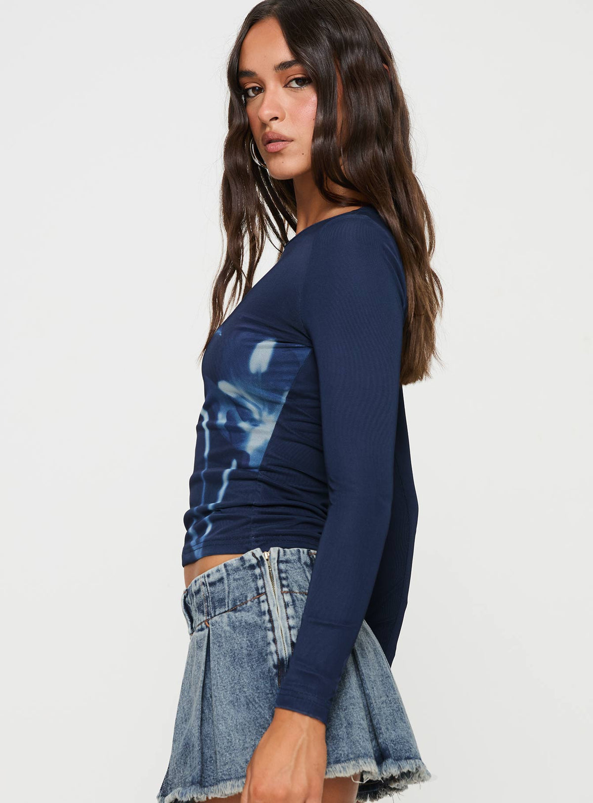 side view of model wearing Princess Polly Raldor Long Sleeve Top Navy Full Sleeves Crew Neck 