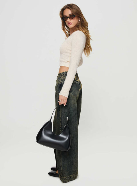 side view of model wearing Princess Polly Ribbon Stamp Low Rise Wide Leg Jeans Antique Wash Mid Rise Jeans Jeans 