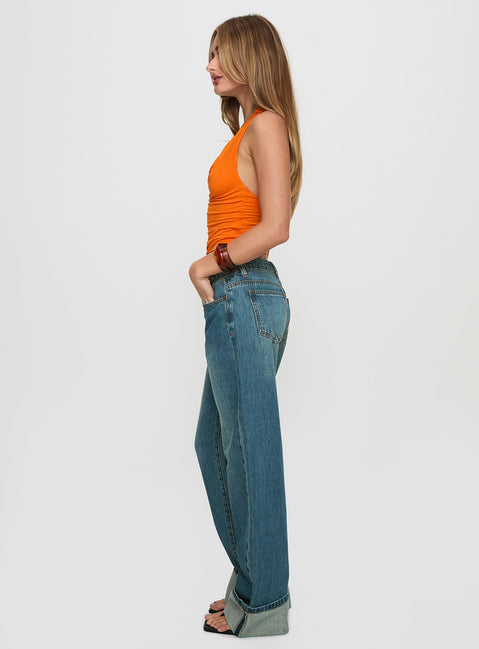 side view of model wearing Princess Polly Toros Mid Rise Wide Leg Foldover Denim Jeans Mid Blue Low Rise Jeans Jeans 