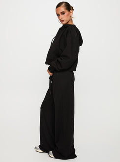 side view of model wearing Princess Polly Mindful Low Rise Pant Black Low Rise Pants Pants 