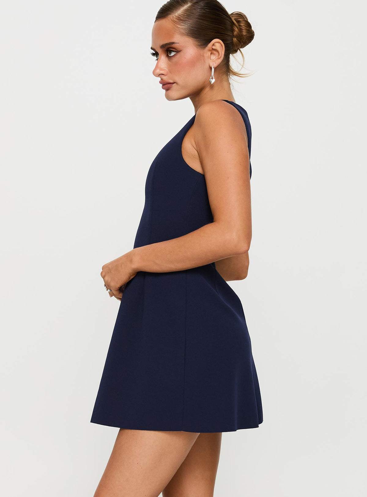 side view of model wearing Princess Polly Anse Mini Dress Navy Crew Neck 