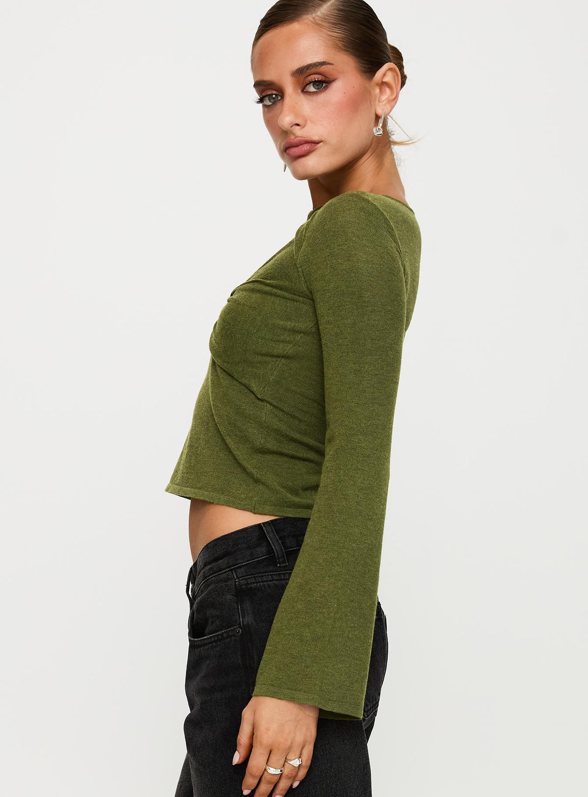 side view of model wearing Princess Polly Giordani Long Sleeve Twist Top Moss Green Full Sleeves Crew Neck 