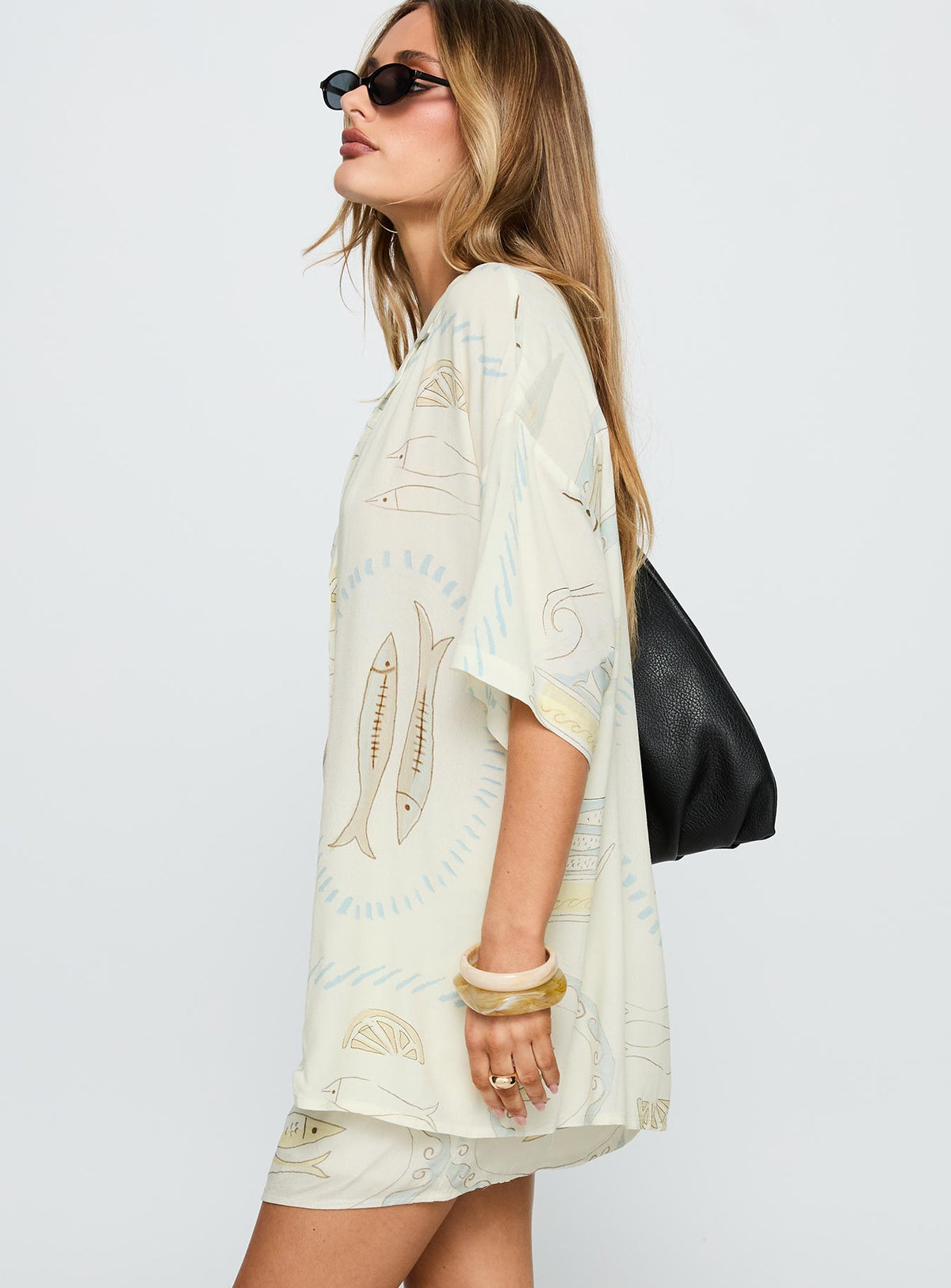 side view of model wearing Princess Polly Caraliia Shirt Cream Half Sleeves V-Neck 