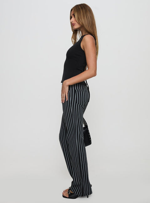 side view of model wearing Princess Polly Allude Low Waist Pinstripe Pant Black Low Rise Pants Pants 